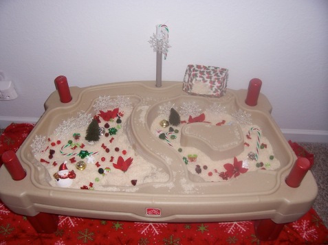 Christmas Sensory Table- we just filled Hula Girl's water table with peppermint-scented rice and Christmasy goodness!